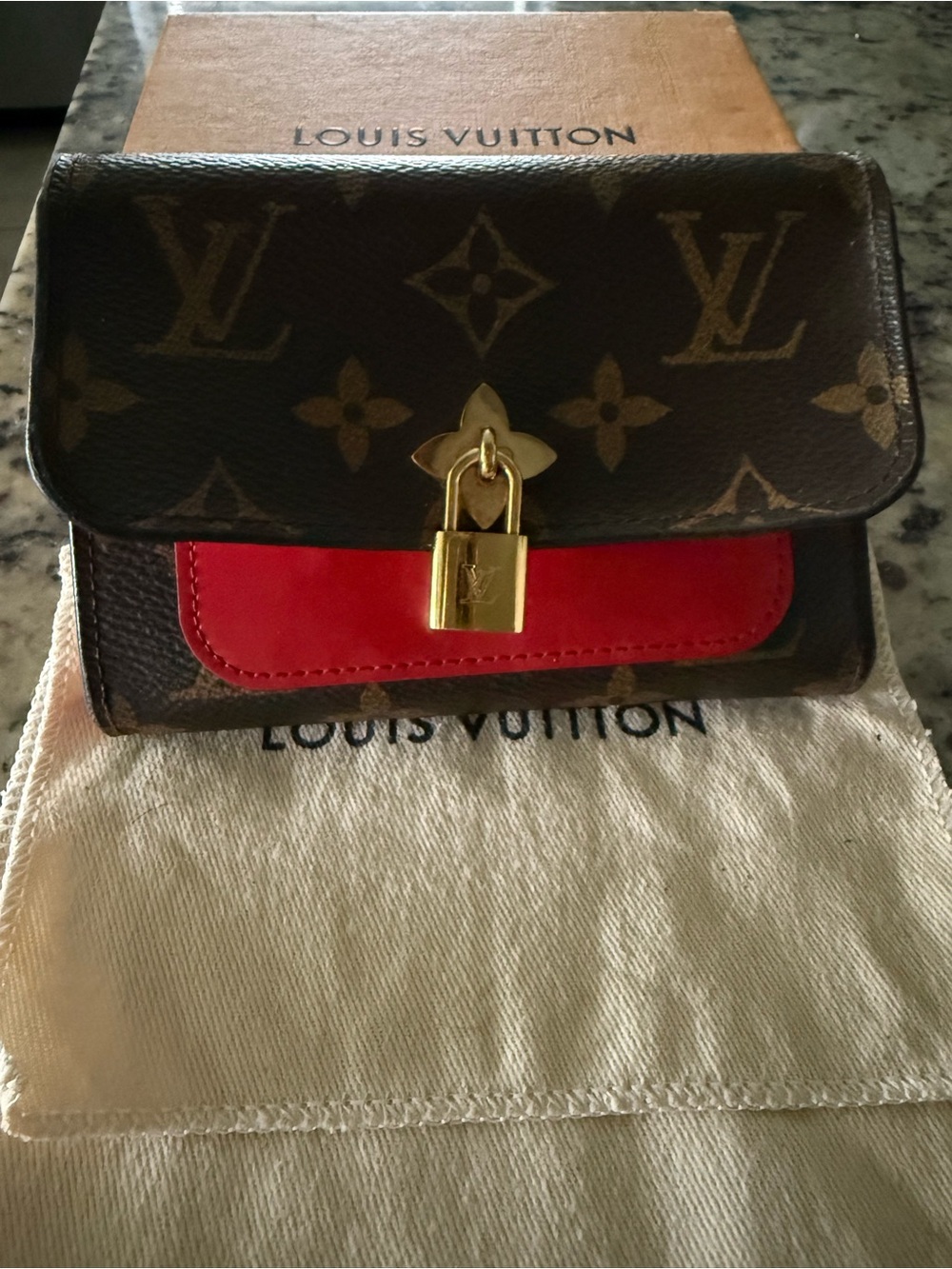 Louis Vuitton Monogram Mini Bag with Red Accent and Gold Lock